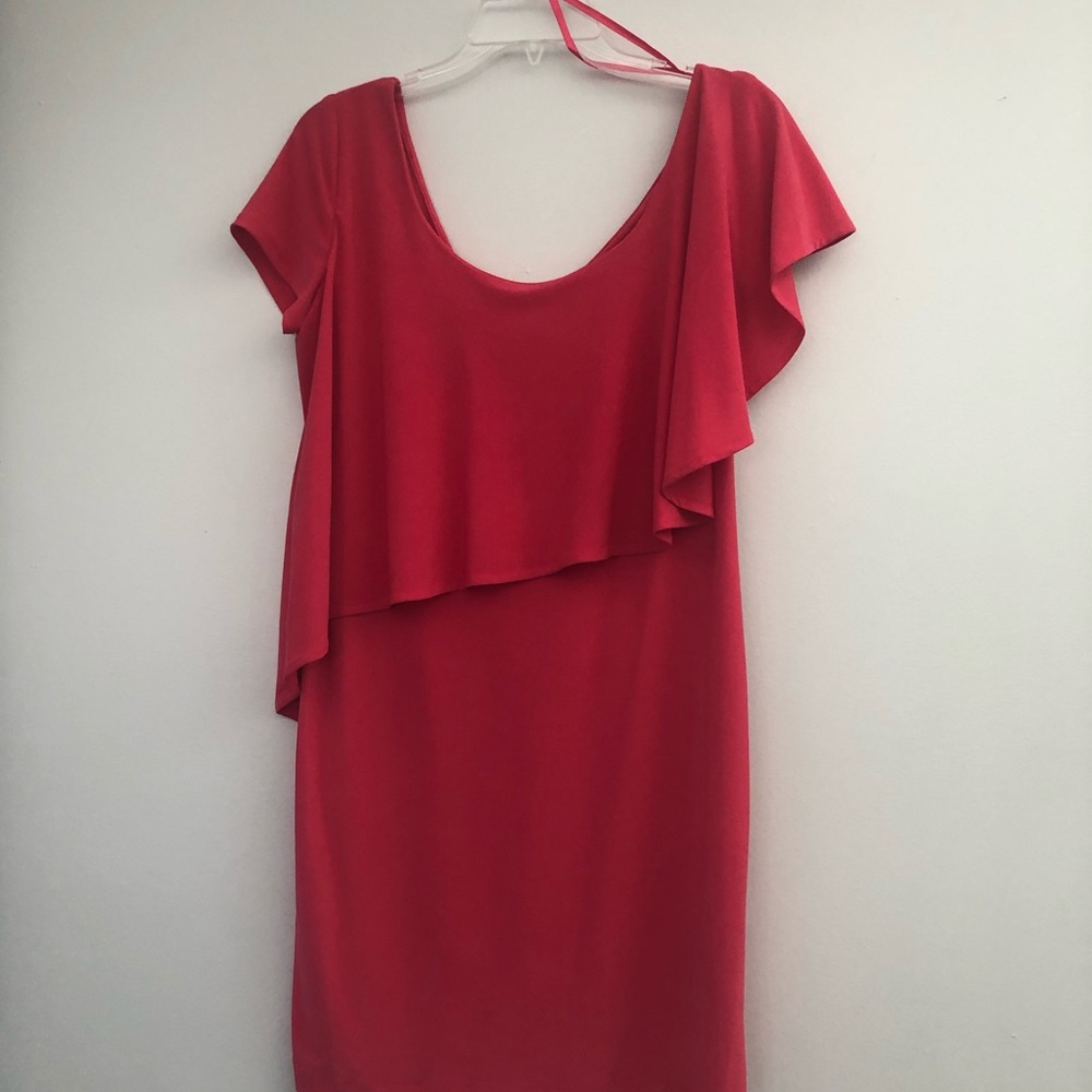 Short pink or watermelon colored dress. Cap sleeves with flowey detail. Size 8.